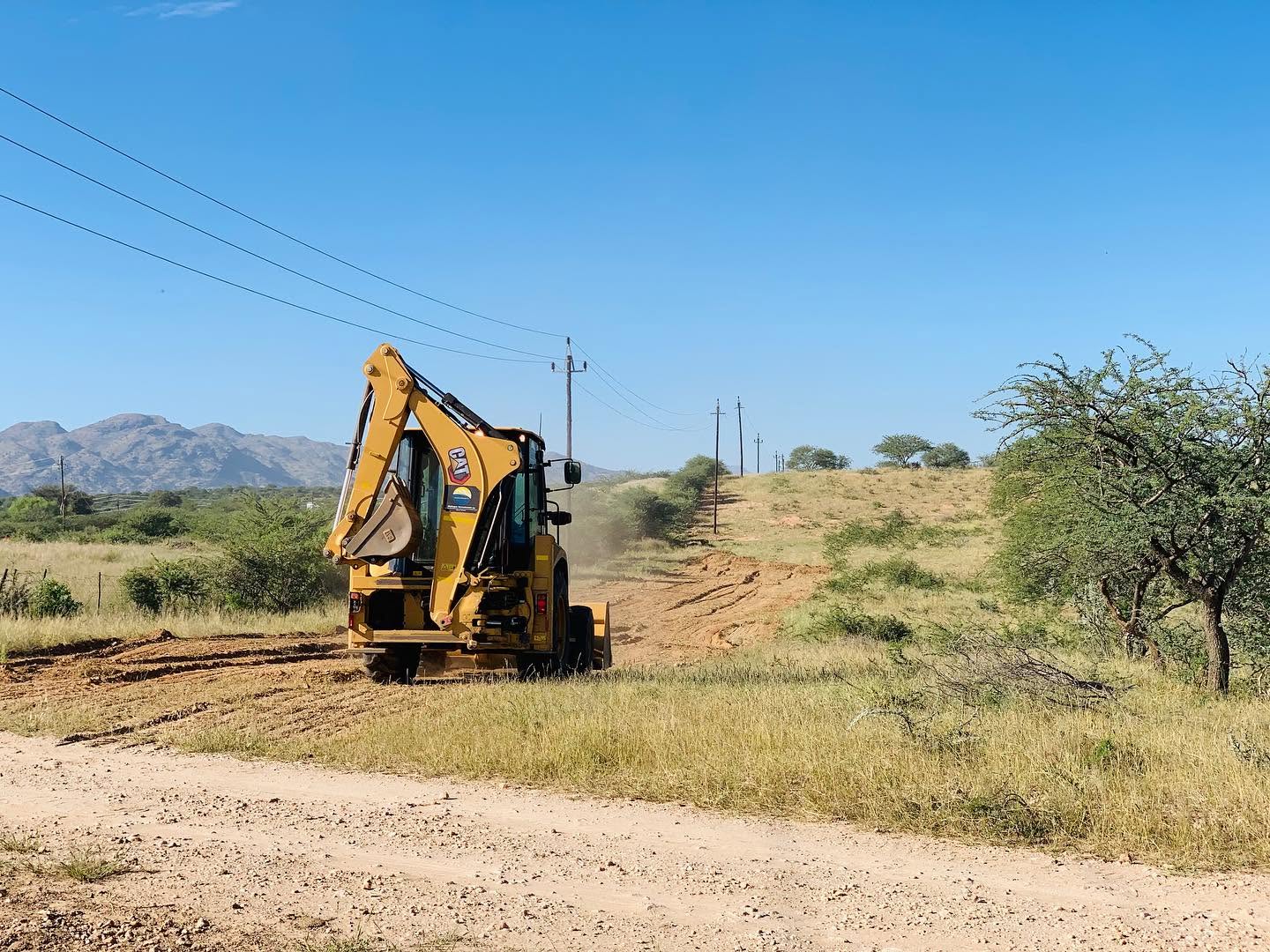 Land development machinery on a road site